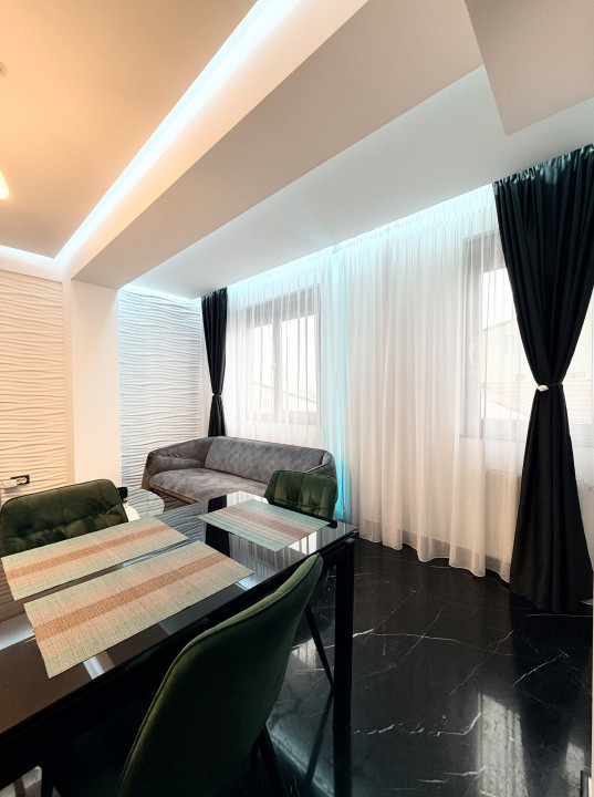 Apartament frumos amenajat de inchiriat cu centrala si parcare 